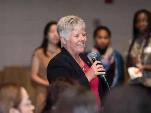 A woman holding a microphone
