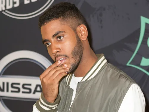 A man with his hand on his chin