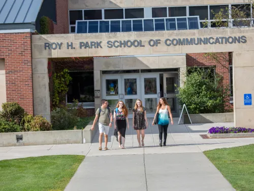 students walking into a building