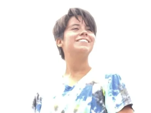 A young woman standing outside