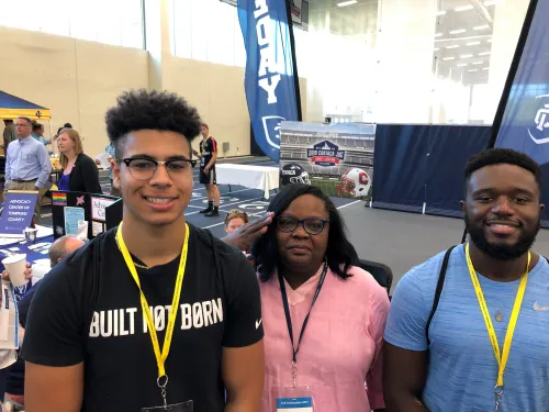 Students and a parent at check-in