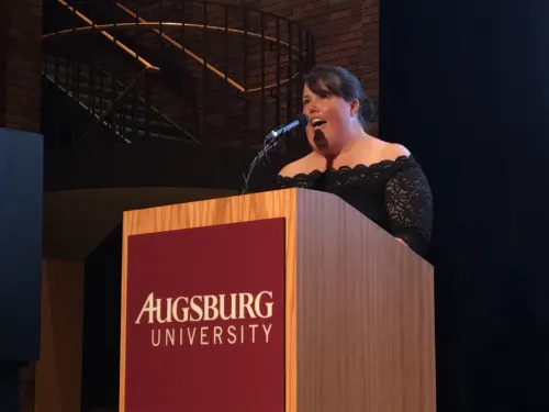 A woman speaking at a podium