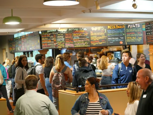 Young people stand at a food court location