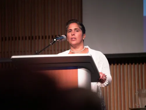 A woman speaking at a podium