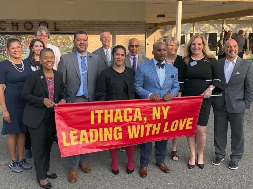 Group of people behind a banner