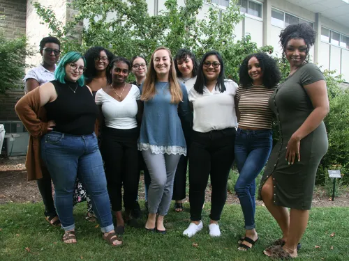 A group of women posing outside