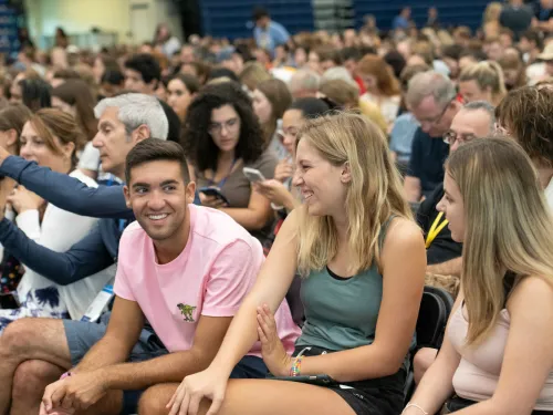 A crowd of people sitting