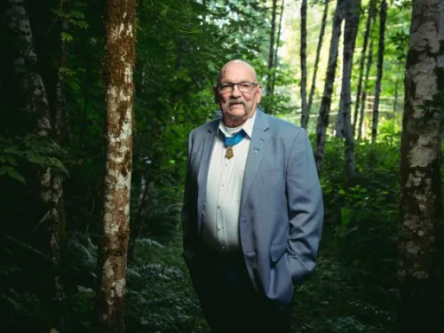 A man standing in the woods