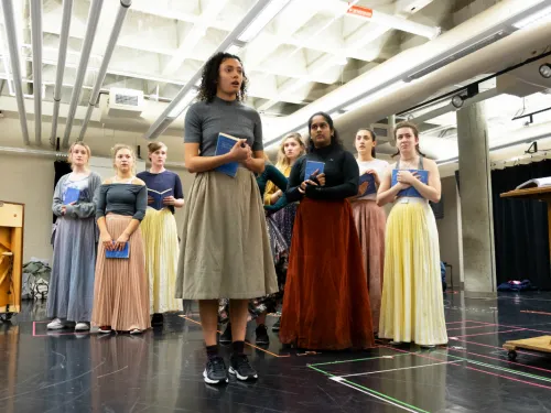 A group of women holding books