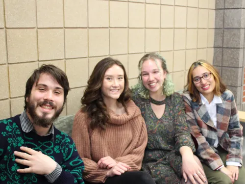 Students looking at a laptop