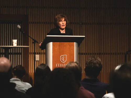 A woman speaking at a podium