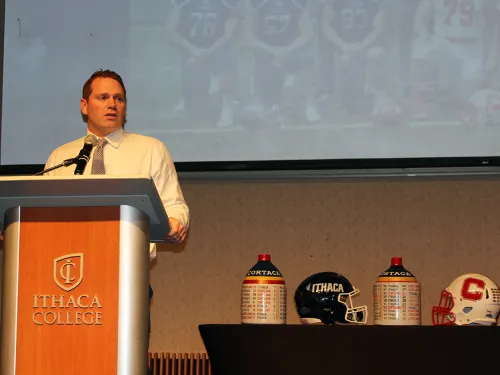 IC football coach at press conference