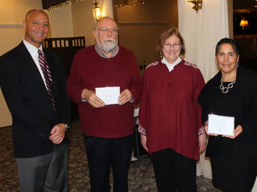 people standing with awards