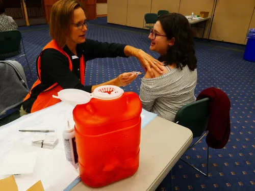 Staff member receiving a flu shot