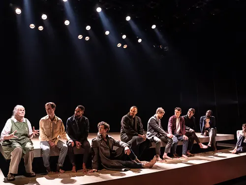 men on stage in a Broadway show
