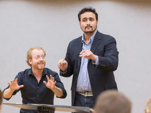 Professor helping a student conduct