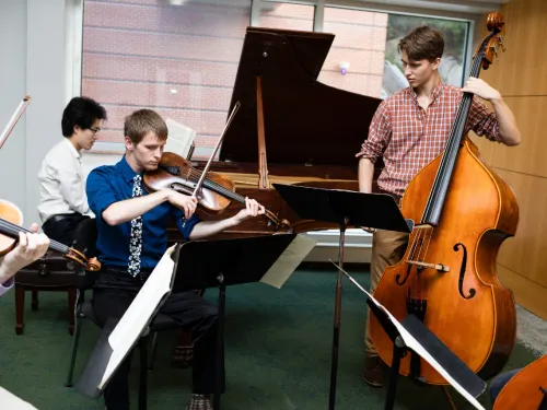 Group rehearsing in Husa Gallery
