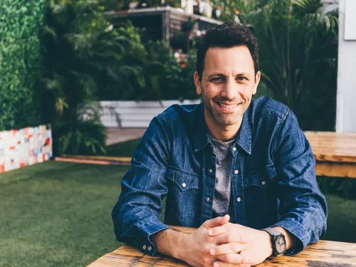 man at a table outside