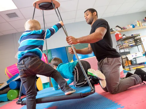 Occupational therapist student works with children