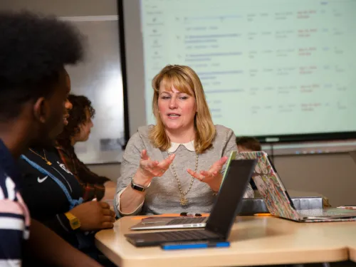 Instructor working with a group of students