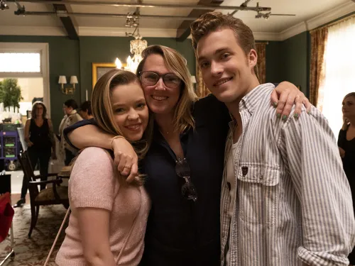 three people embracing