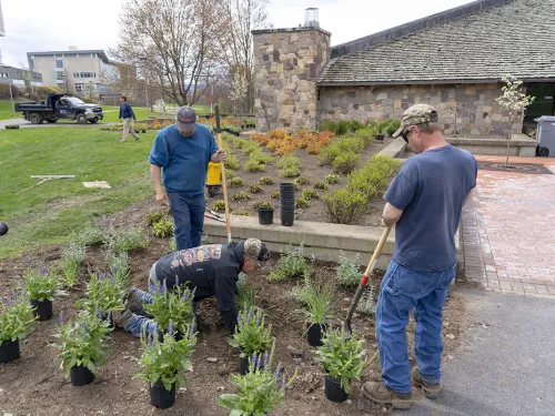 Facilities staff working outside. 