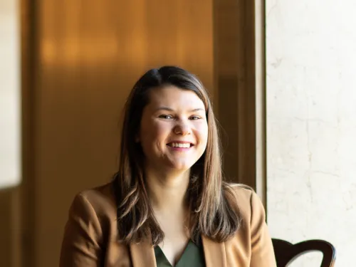 Person sitting in chair smiling