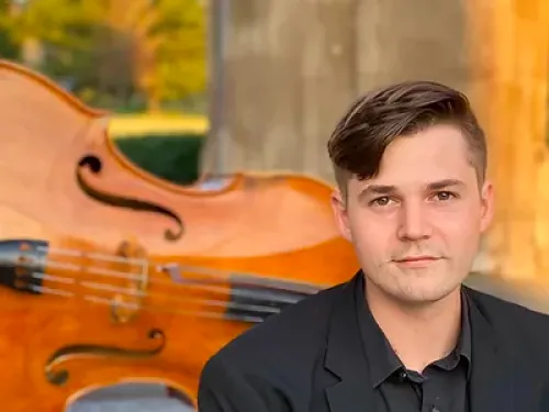Man sitting in front of double bass