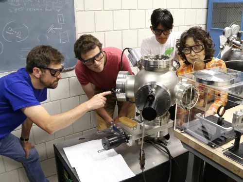 Chemistry and physics collaboration in a lab.