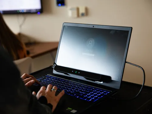 A person typing on a computer