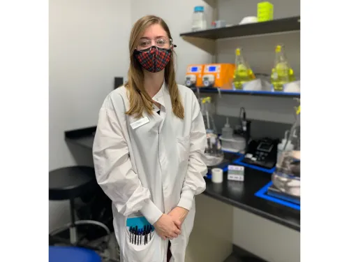 Sarah Griffin in a lab coat