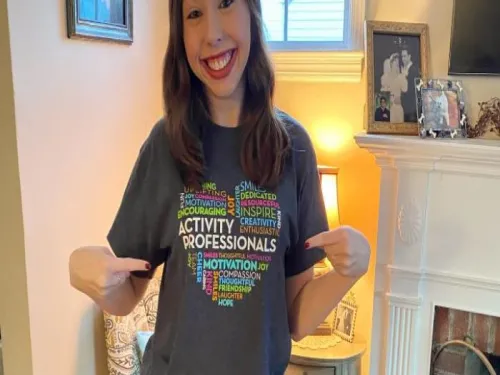 Woman pointing at her shirt