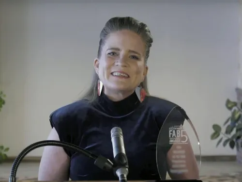 woman receiving award