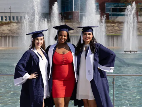 Seniors stand in front of the fountains