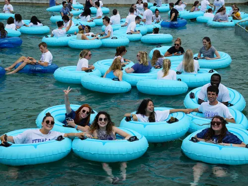 Students in inner tubes in Dillingham Fountain
