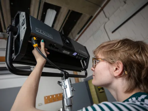 Student working with a camera