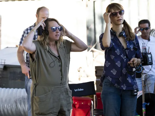 Liz Tigelaar on Set Wearing Headphones