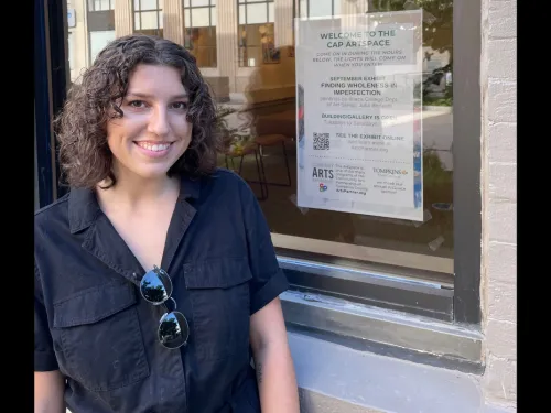 Julia Burtussi ’22 standing outside the Community ArtSpace
