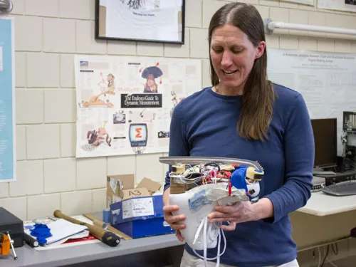 Dr. King looking at an ice skate
