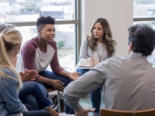 small group of people in discussion circle