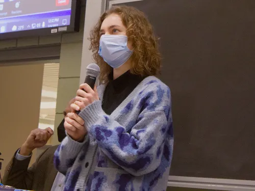 Student holding a mic