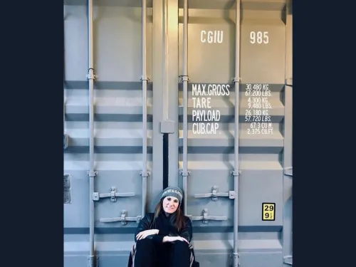 Rory Rubin in front of a shipping container