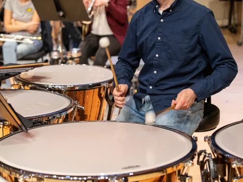 student playing drums