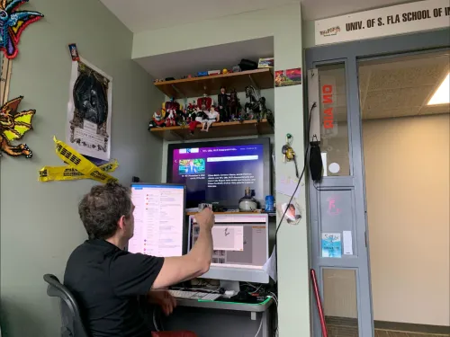 Edd Schneider sitting at a computer