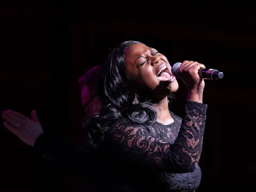 female singing into a microphone