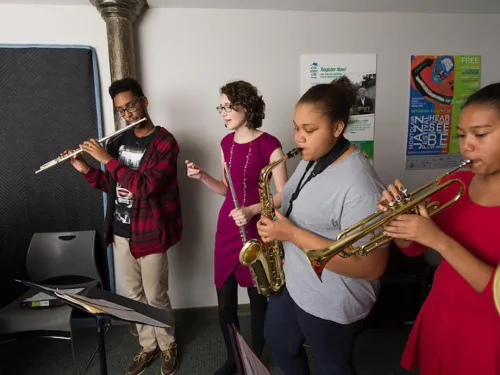 students rehearsing together