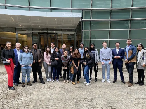 Students and Faculty outside the Bloomberg Building