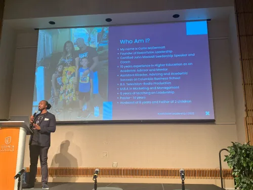 Colin McDermott standing on stage