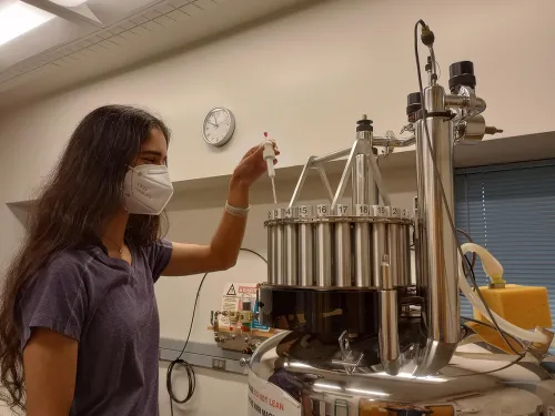 Student using an NMR machine.