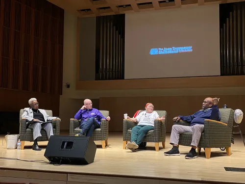 President Cornish, Loki MulHolland, Joan Mulholland and Luvaughn Brown sitting on stage